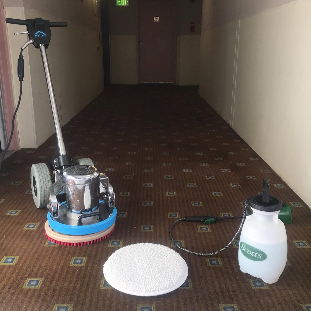 Carpet cleaning machine staged in a facility hallway
